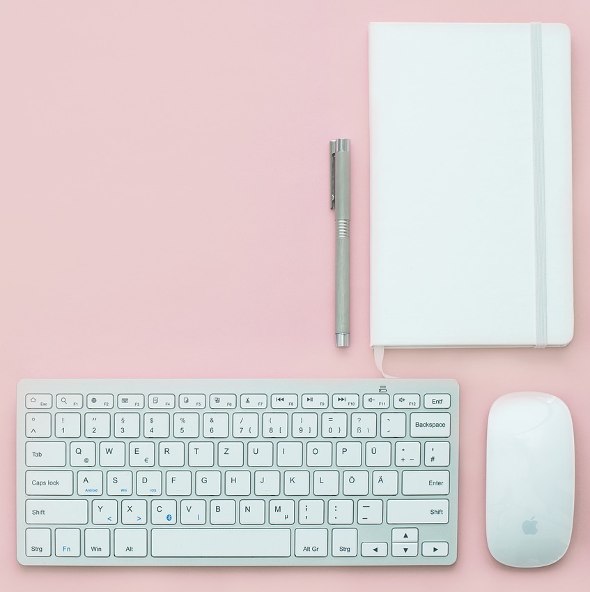 Image of notebook, pen, mouse and keyboard